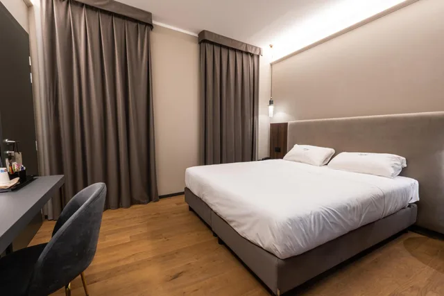 غرفة بسرير مزدوج أو سريرين منفصلين، Touring Hotel Bologna 1/3