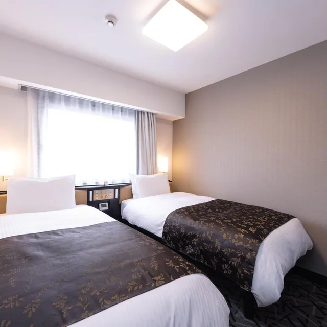 غرفة صغيرة بسريرين منفصلين، Apa Hotel Saga-Ekimae-Chuou 1/4