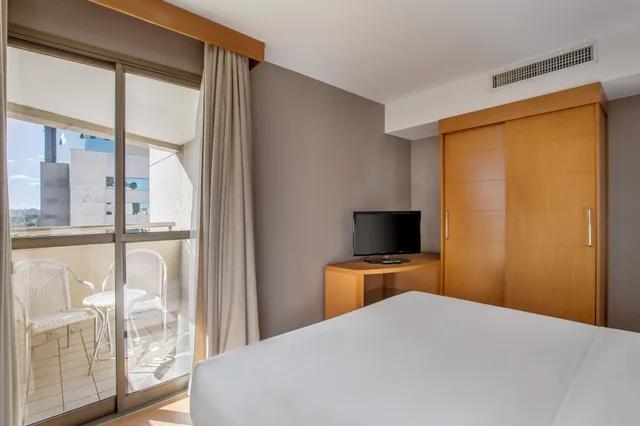 غرفة بريميوم بسرير كينج وسرير كوين مع أريكة، Brasil 21 Suites Affiliated by Melia 1/10