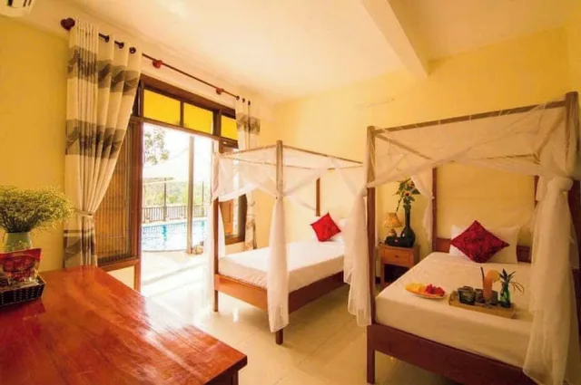 جناح عائلي بسرير كوين وسريرين منفصلين بإطلالة على المسبح بغرفتي نوم، Phong Nha Lake House 7/10