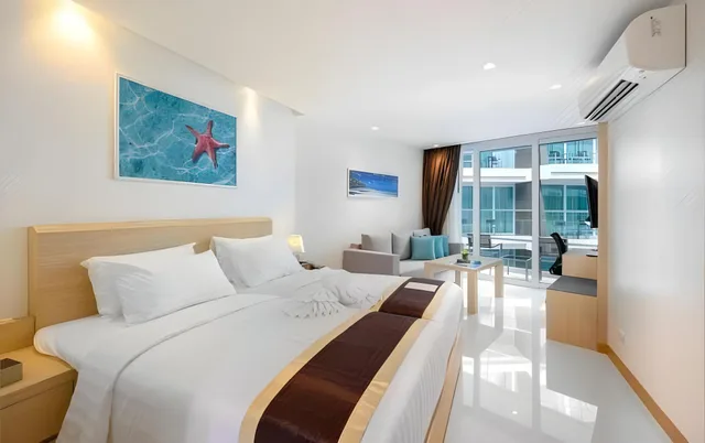 غرفة ديلوكس بسرير فردي، The Beachfront Hotel Phuket 1/2