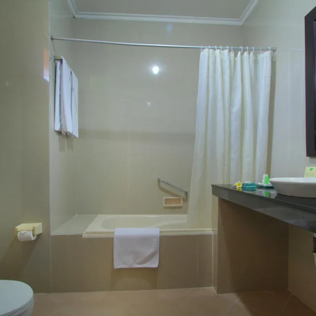 غرفة ديلوكس بسرير مزدوج أو سريرين منفصلين مع سرير إضافي، Adi Dharma Hotel Legian 2/2