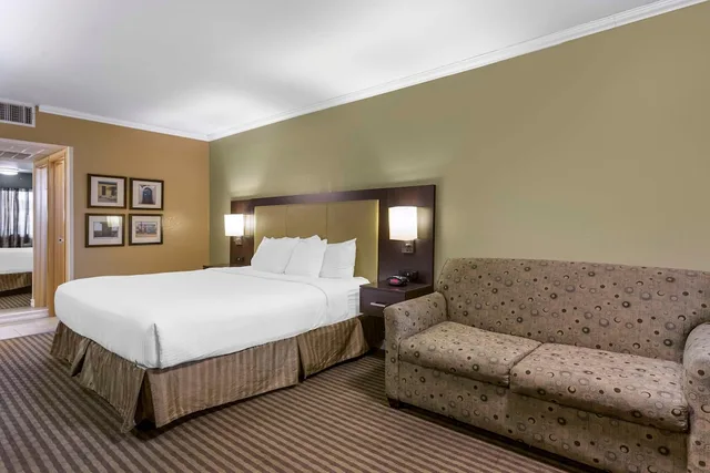 Signature, King Bed, Sofa, Royal Sun Inn & Suites 2/5