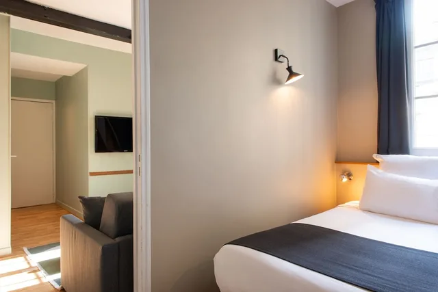 جناح بسرير كوين بغرفتي نوم مع أريكة، Helzear Montparnasse Suites 2/5