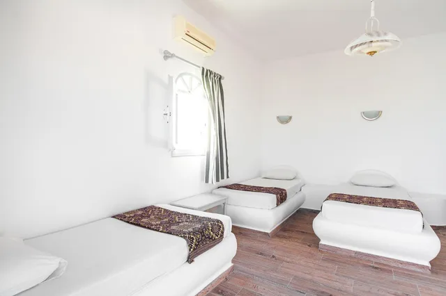 غرفة سوبيريور ثلاثية بإطلالة على البحر، Villa Iliovasilema Santorini 2/6