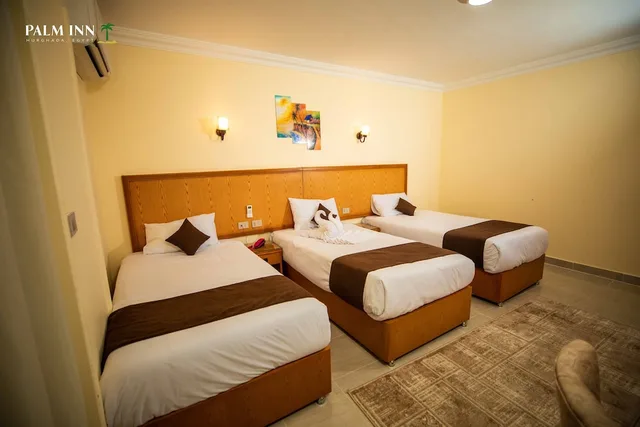 غرفة مفردة بسرير كوين، Palm Inn Hotel 3/9