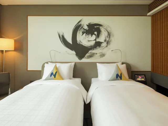 غرفة تنفيذية بسريرين منفصلين، Novotel Ambassador Seoul Dongdaemun Hotels and Residences 2/7