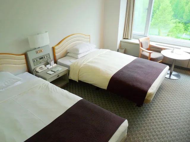 غرفة بسريرين منفصلين بإطلالة على الجبل في طابق مرتفع للمدخنين، Shin Furano Prince Hotel 4/6