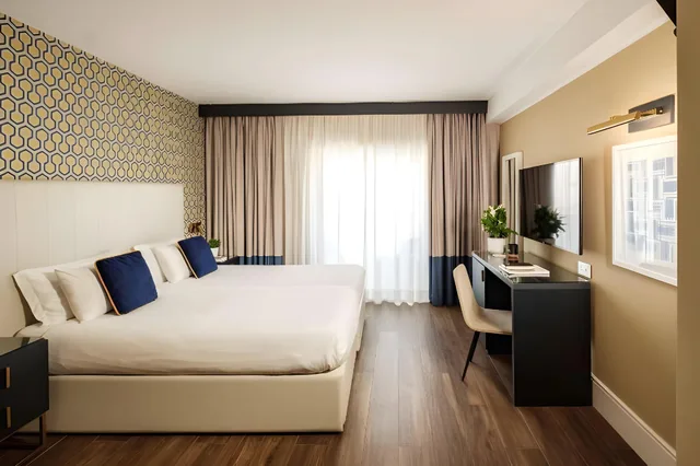 غرفة تنفيذية بسرير كينج وسرير مزدوج، 115 The Strand Hotel And Suites 1/2