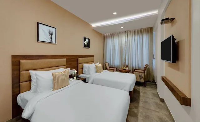 Green, Twin Beds، The Fern Residency Bhuj 1/3
