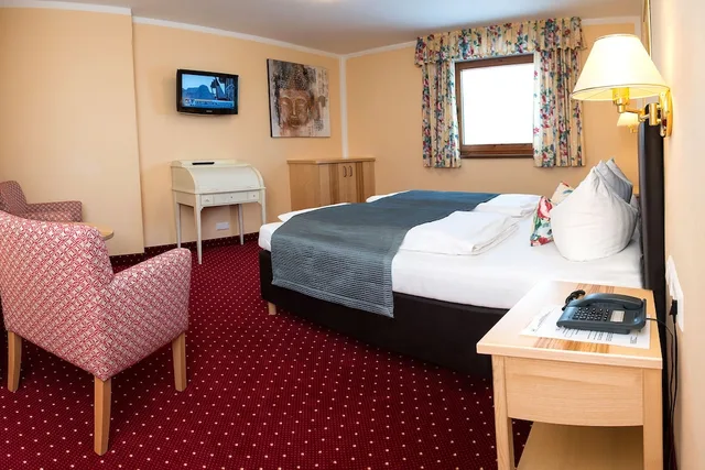 جناح جونيور بسرير كينج مع أريكة، Hotel Schneeberger 2/5