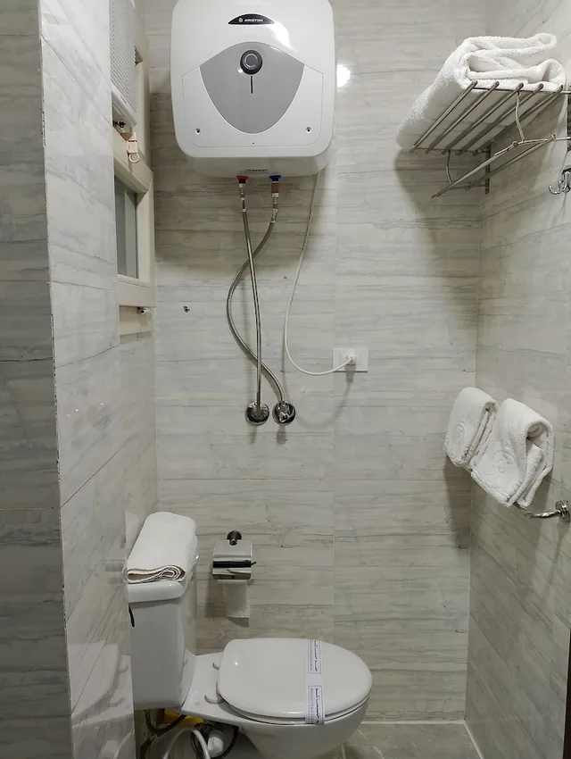 استوديو ديلوكس بسريرين منفصلين مع أريكة، Royal Inn Residence New Cairo 7/9