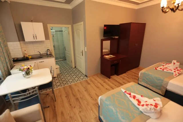 غرفة ديلوكس عائلية بسرير مزدوج وسرير فردي مع أريكة، White Pearl Apart 1/3