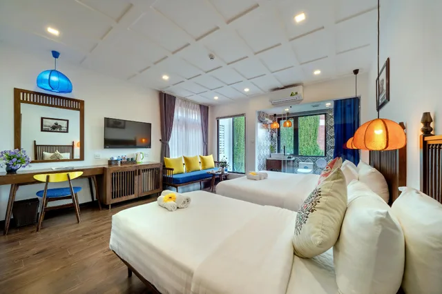غرفة فاخرة ثلاثية بسرير كوين وسرير فردي، Son Trang Hotel Hoi An 2/2