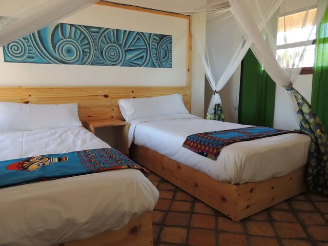 غرفة أساسية بسريرين منفصلين بإطلالة جزئية على البحر، Duna Lodge 1/2