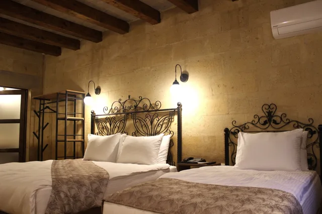 غرفة ديلوكس ثلاثية بسرير كينج وسرير فردي، Kayra cave suites 4/10