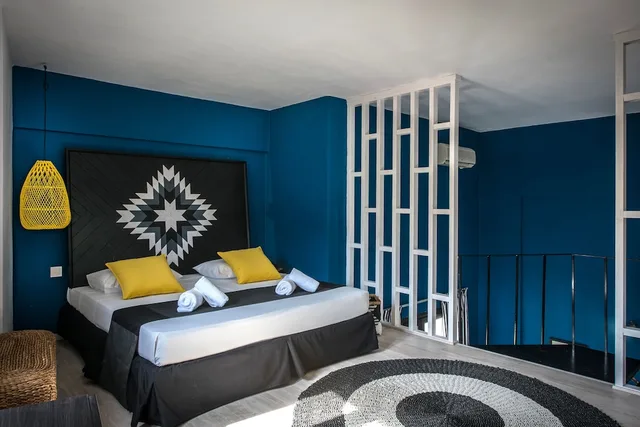 جناح سوبيريور بسرير كينج مع أريكة، Indigo Suites Collection 1/5
