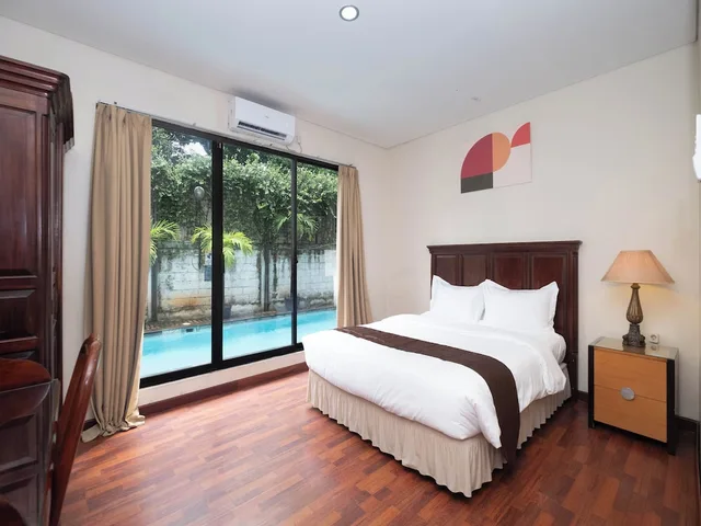 غرفة ديلوكس بسريرين منفصلين، Arimbi Pejaten Suites 2/8
