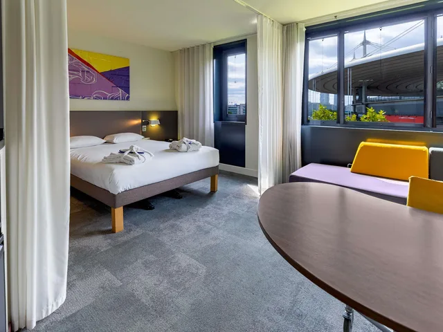 جناح تنفيذي بسرير مزدوج مع أريكة، Novotel Suites Paris Stade De France 5/10