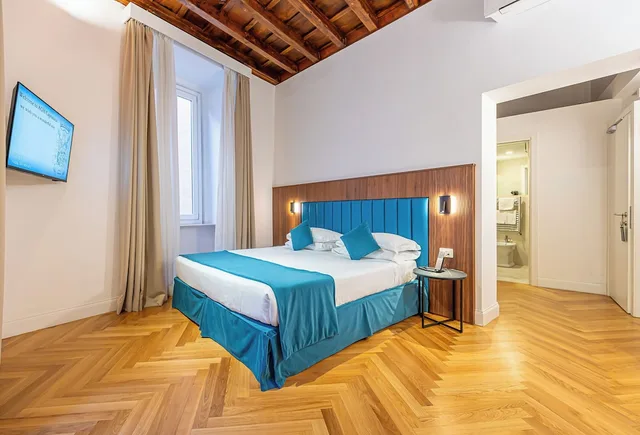غرفة ديلوكس ثلاثية بسرير كينج وسرير فردي في الملحق، Albergo Abruzzi 3/9
