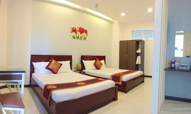 غرفة عائلية رباعية بسريرين مزدوجين بإطلالة على الحديقة للمدخنين، QUAN QUAN HOTEL 3/6
