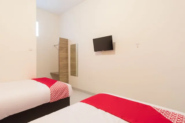 غرفة قياسية بسريرين منفصلين، OYO 873 Kamani Homestay Syariah 3/5
