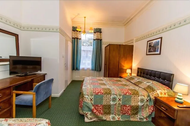غرفة بسرير مزدوج مع سرير إضافي، The Carlton Hotel 1/1