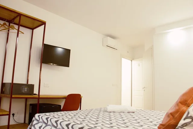 غرفة ديلوكس ثلاثية بسرير مزدوج وسرير فردي، Hotel Ciao 1/6