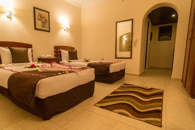 غرفة سوبيريور بثلاثة أسرّة بإطلالة على المسبح بغرفة نوم واحدة، Tivoli Hotel Aqua Park 3/5