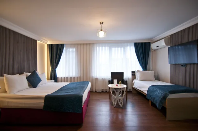 غرفة ديلوكس بسرير كوين وسرير فردي، Nar Sultan Hotel 2/10