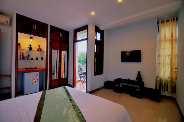 غرفة ديلوكس بسرير كينج بشرفة، Starfruit Homestay Hoi An 9/10
