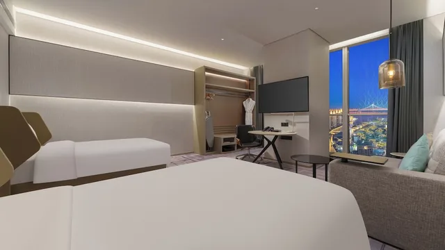 غرفة قياسية بسريرين منفصلين بإطلالة على البحر مع دخول صالة النادي، Crowne Plaza Dalian Xinghai 6/10