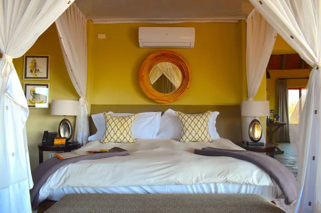 غرفة بريميوم بسرير كينج بغرفة نوم واحدة مع أريكة، Rhulani Safari Lodge 1/4
