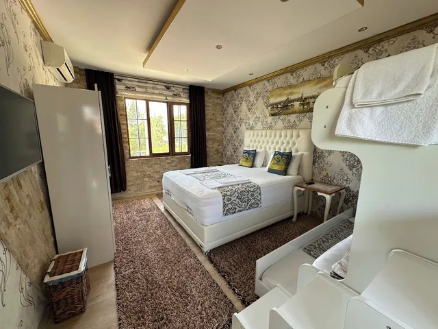 غرفة ديلوكس رباعية بسرير كينج وسرير بطابقين، Sinter Terasse House Hotel 5/6