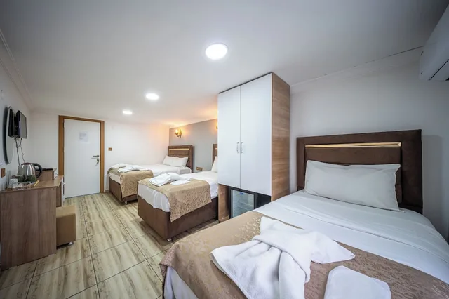 غرفة اقتصادية رباعية بسرير مزدوج وسريرين منفصلين بغرفة نوم واحدة، Laos Otel 2/10