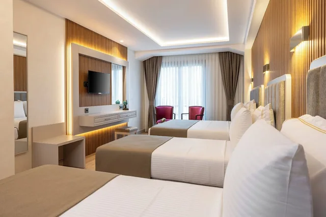 غرفة سوبيريور رباعية بسرير كوين وسريرين منفصلين، CARINA GOLD HOTEL 2/2
