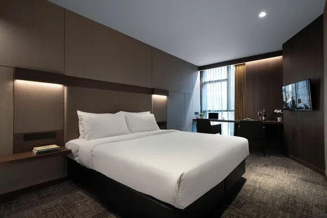 جناح جونيور بسرير كينج مع أريكة، Oakwood Bencoolen Singapore 1/7