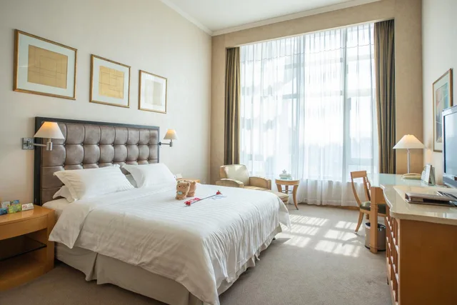 غرفة ديلوكس بسرير كينج وسرير كوين، Shantou Junhua Haiyi Hotel 1/2