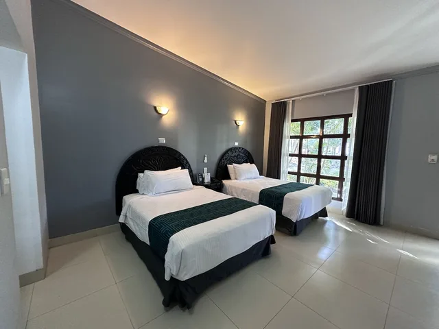 غرفة قياسية بسريرين مزدوجين بإطلالة على المسبح، InHouse Select Hacienda Tres Rios 2/6