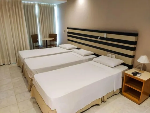 غرفة قياسية ثلاثية بسرير مزدوج وسرير فردي، Savassi Village Ex Toronto Tower Residence 1/4
