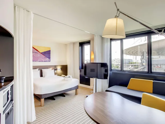 جناح تنفيذي بسرير مزدوج مع أريكة، Novotel Suites Paris Stade De France 1/10