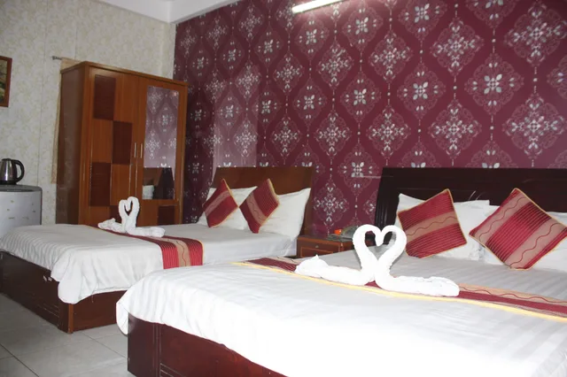 غرفة ديلوكس ثلاثية بسرير كوين وسرير فردي بإطلالة على المدينة، Yoko Airport Saigon Hotel 6/10