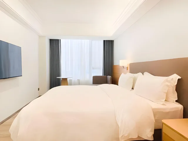 غرفة ديلوكس بسرير كوين، La Perle International Hotel 1/2