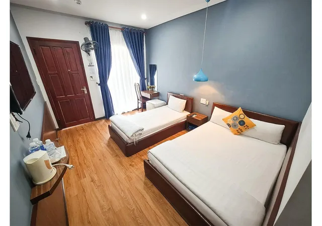 غرفة ثلاثية بسرير كوين وسرير فردي، QUAN QUAN HOTEL 5/7