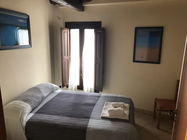 شقة عائلية بسريرين مزدوجين بغرفتي نوم مع أريكة، Residence Cortile Merce 1/8