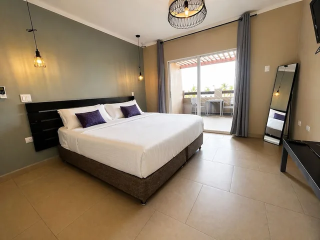 غرفة بسريرين منفصلين بشرفة، Eden Beach Resort 1/3