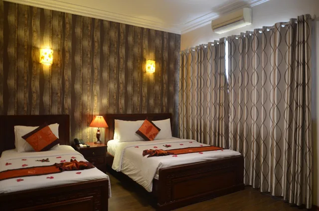 غرفة ديلوكس عائلية بسرير كوين وسرير فردي، Phoenix Legend Hotel 3/10
