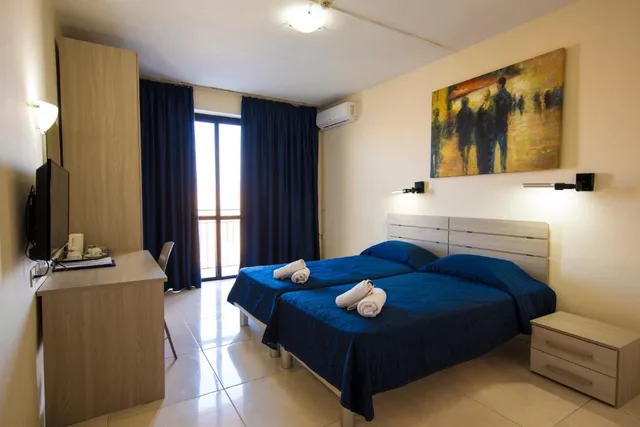 غرفة اقتصادية بسرير مزدوج أو سريرين منفصلين، Relax Inn Hotel 1/2