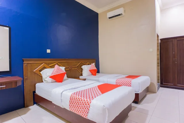 غرفة ديلوكس بسريرين منفصلين، OYO 1636 Wisma Kuta Karang 1/7