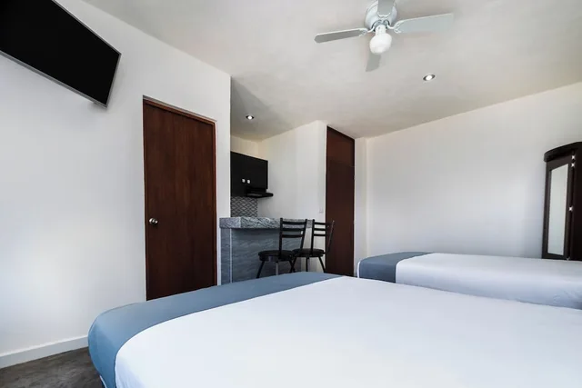غرفة ديلوكس بسريرين مزدوجين، Capital O Hotel Joyma Suites, San Luis 1/7